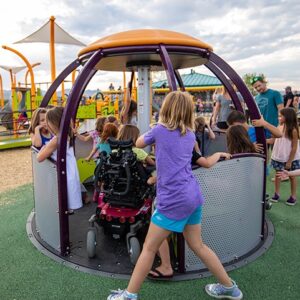 kids-playing-on-inclusive-playground-equipment